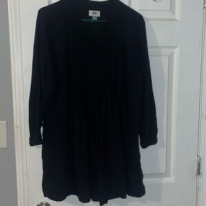 Black flowly dress. Long sleeve, short above the knee.